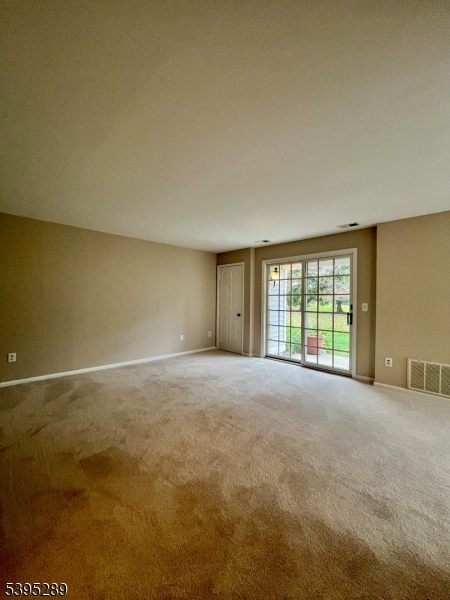 133 Mockingbird Court Three Bridges, NJ 08887 - Photo 10 of 21 a view of an empty room with a window