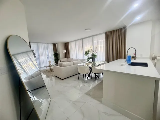 a living room with furniture and a window