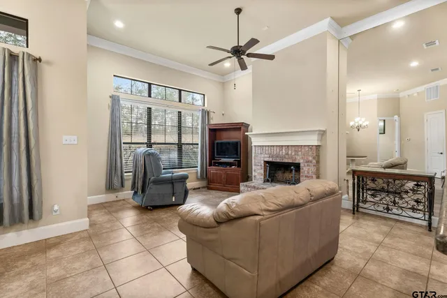 a living room with furniture and a fireplace