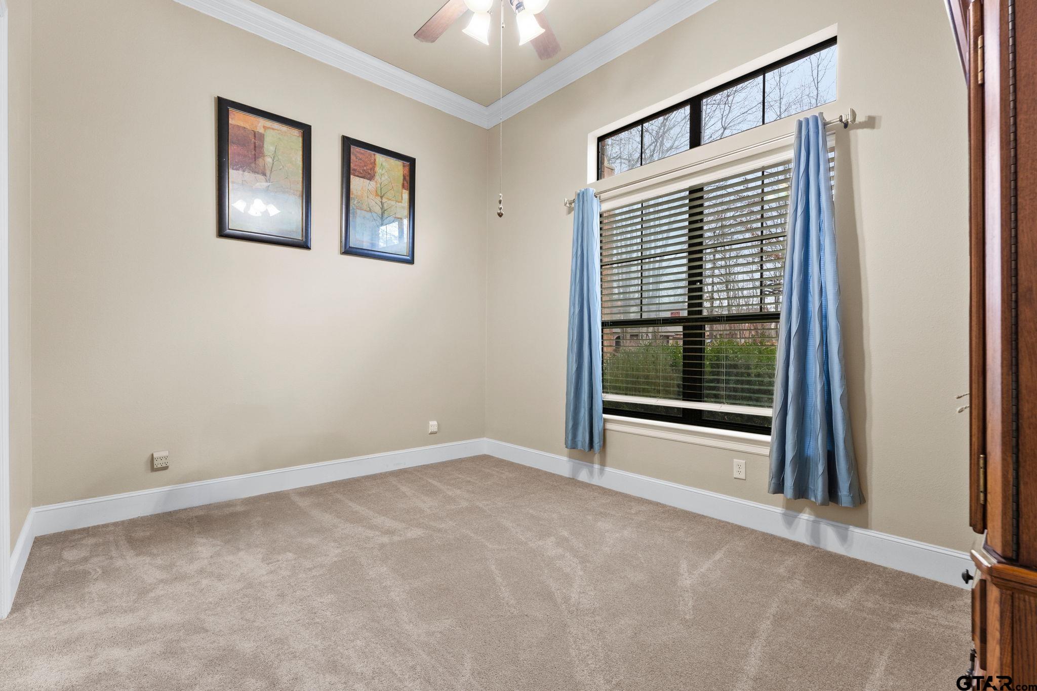1857 Stonecrest Boulevard, Unit 1302 Tyler, TX 75703 - Photo 12 of 29 a view of an empty room with a window