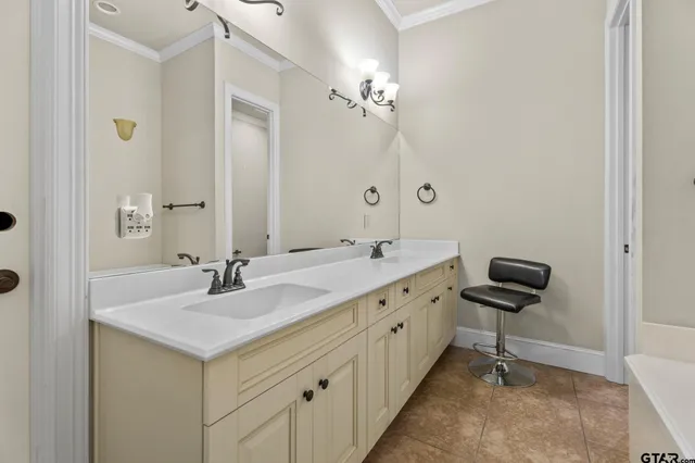 a bathroom with 2 sink and a mirror