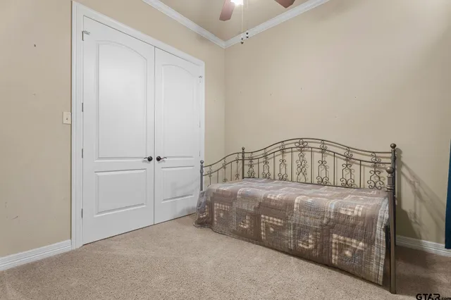 a bedroom with a bed in it