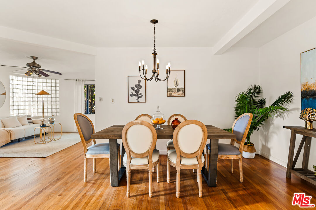 1100 Victoria Avenue Venice, CA 90291 - Photo 9 of 30 a view of a dining room with furniture window and wooden floor