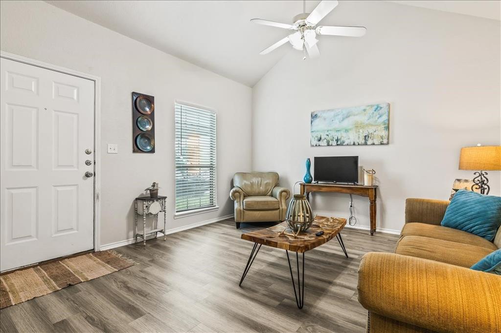 115 Collett Court Weatherford, TX 76088 - Photo 1 of 11 a living room with furniture and a flat screen tv