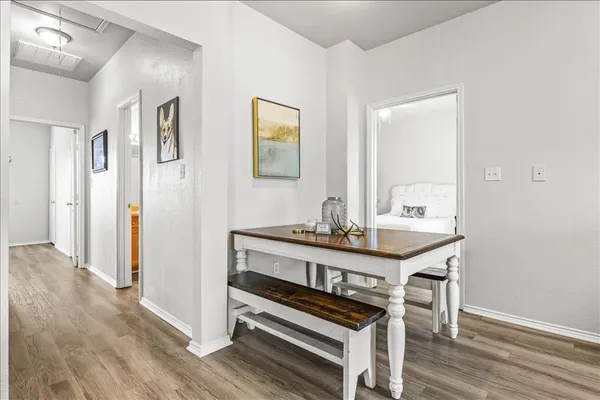 a view of a livingroom with furniture and wooden floor