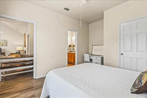 a bedroom with a bed and a dresser
