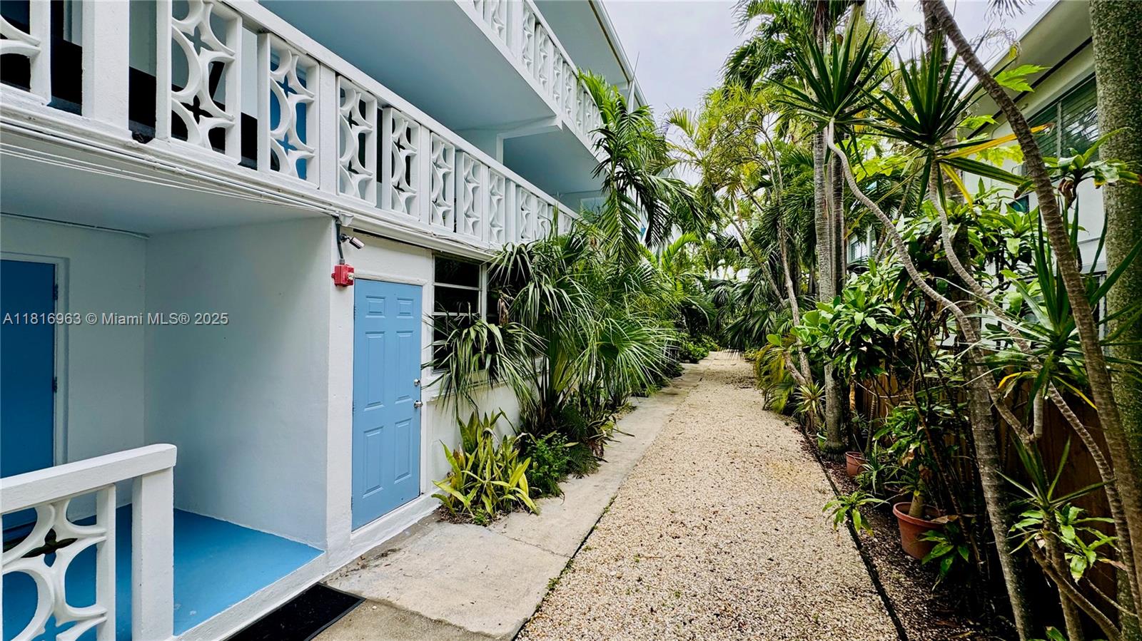 1120 102nd Street, Unit 7 Bay Harbor Islands, FL 33154 - Photo 15 of 22 a view of a pathway of a house with plants