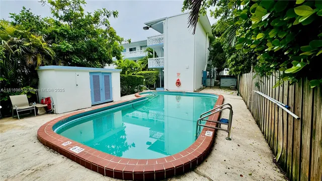 a view of a swimming pool with a patio