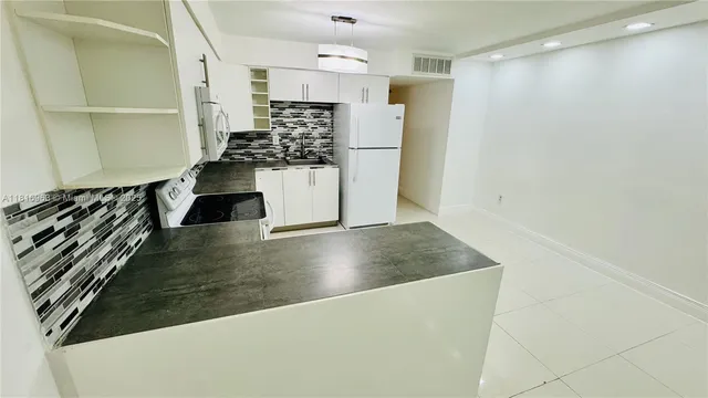 a view of kitchen and stainless steel appliances