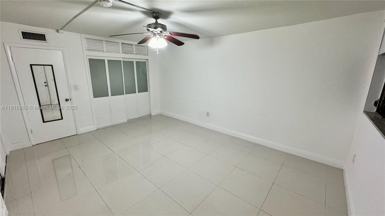 1120 102nd Street, Unit 7 Bay Harbor Islands, FL 33154 - Photo 8 of 22 en empty room with windows