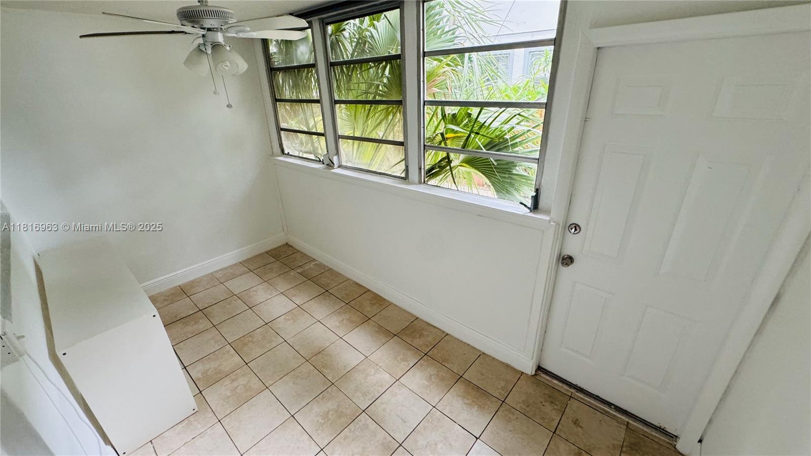 1120 102nd Street, Unit 7 Bay Harbor Islands, FL 33154 - Photo 10 of 22 a view of an empty room and window