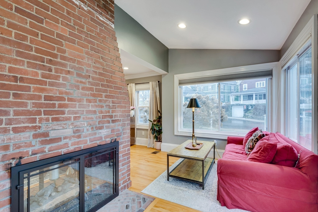 12 Mishawum Road Woburn, MA 01801 - Photo 11 of 39 a living room with furniture and a fireplace