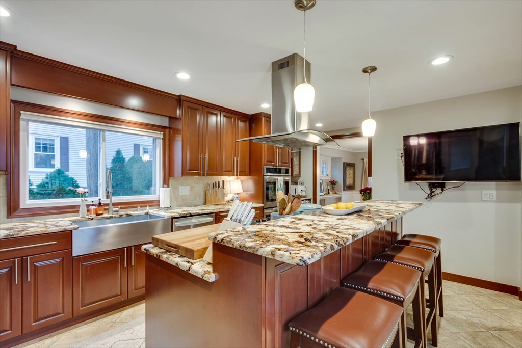 12 Mishawum Road Woburn, MA 01801 - Photo 16 of 39 a kitchen with a stove a sink and a refrigerator