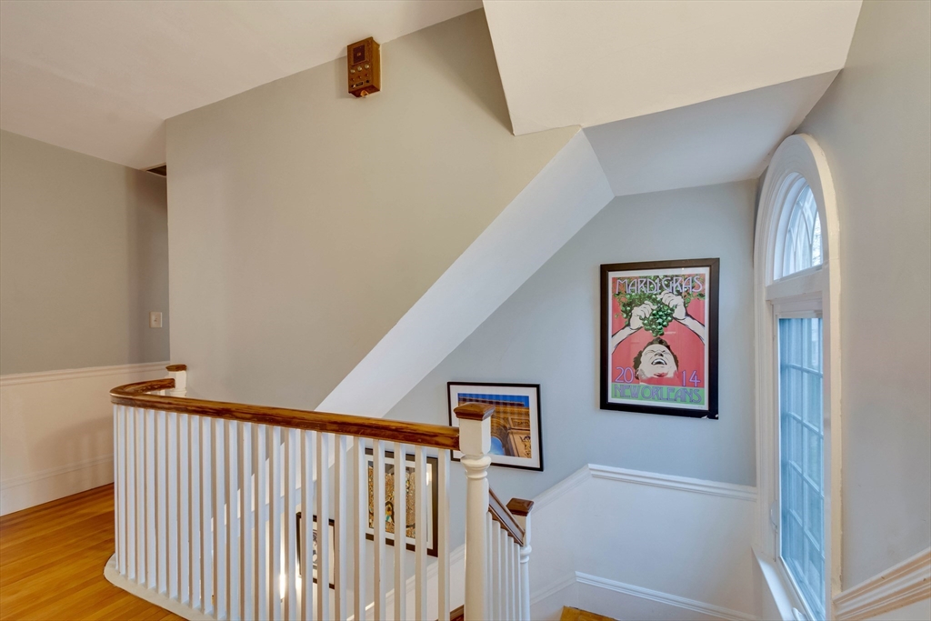 12 Mishawum Road Woburn, MA 01801 - Photo 21 of 39 a view of a hallway with paintings on the wall
