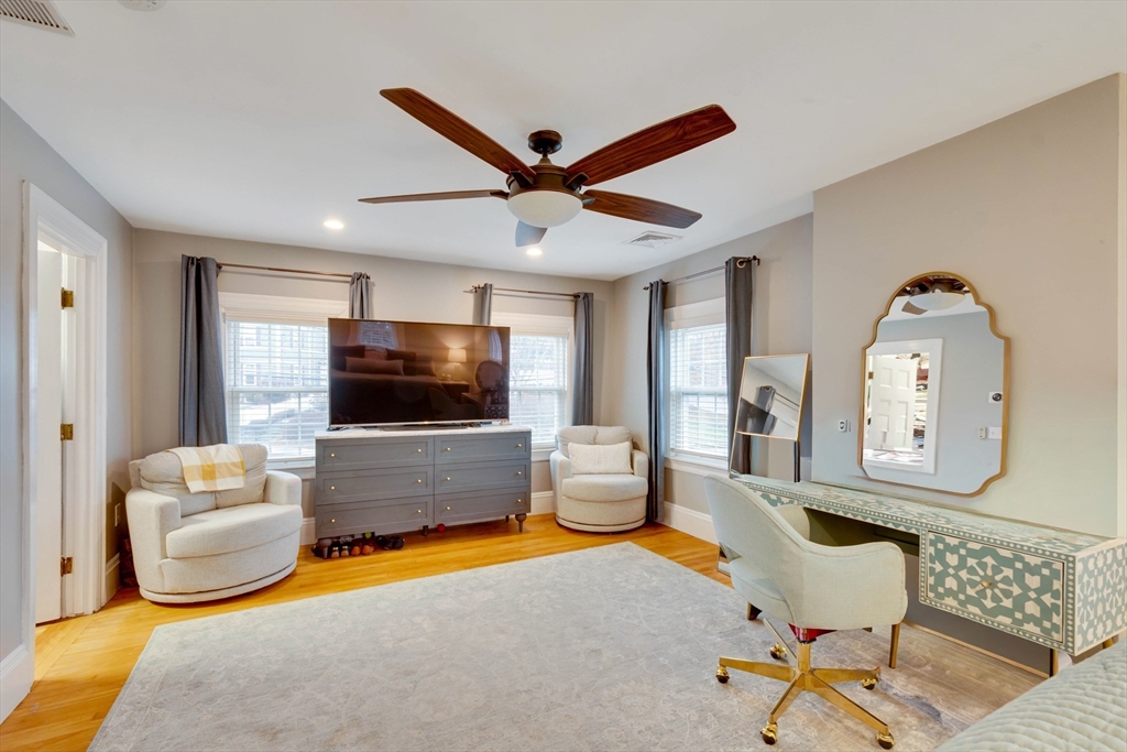12 Mishawum Road Woburn, MA 01801 - Photo 23 of 39 a living room with furniture and a flat screen tv
