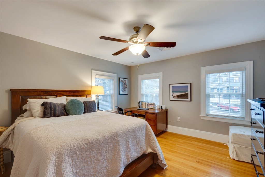12 Mishawum Road Woburn, MA 01801 - Photo 25 of 39 a bedroom with a bed and wooden floor