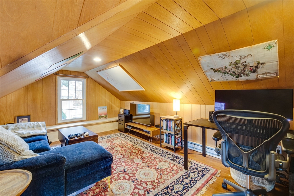 12 Mishawum Road Woburn, MA 01801 - Photo 27 of 39 a living room with furniture and a rug