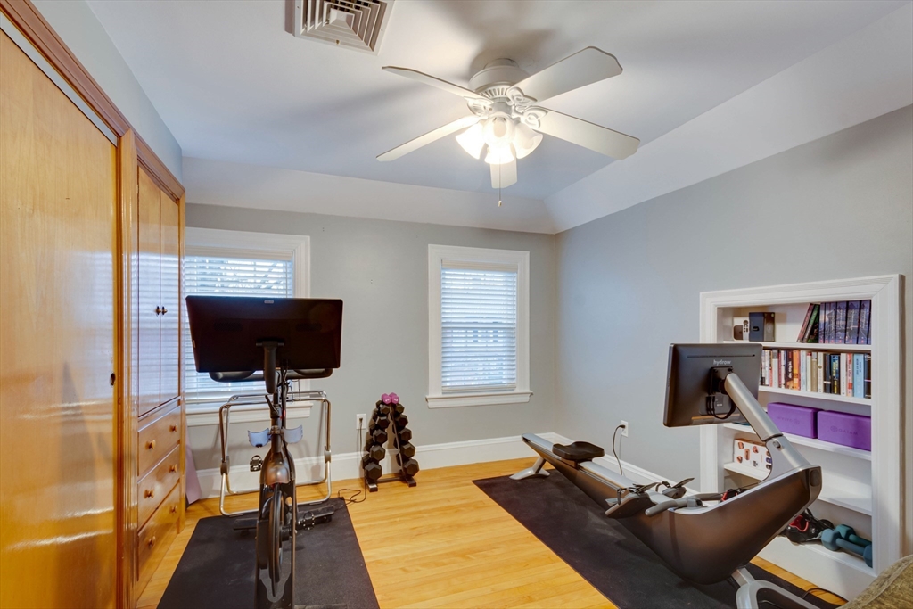 12 Mishawum Road Woburn, MA 01801 - Photo 28 of 39 a room with a couch and a flat screen tv