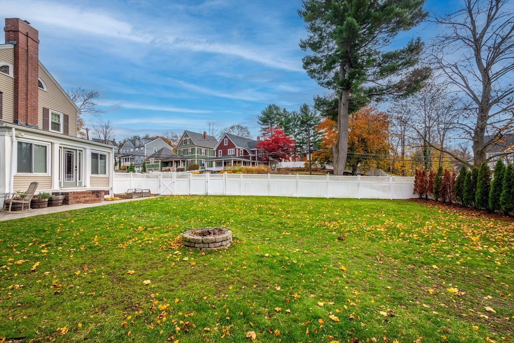 12 Mishawum Road Woburn, MA 01801 - Photo 34 of 39 a view of a house with a backyard porch and sitting area