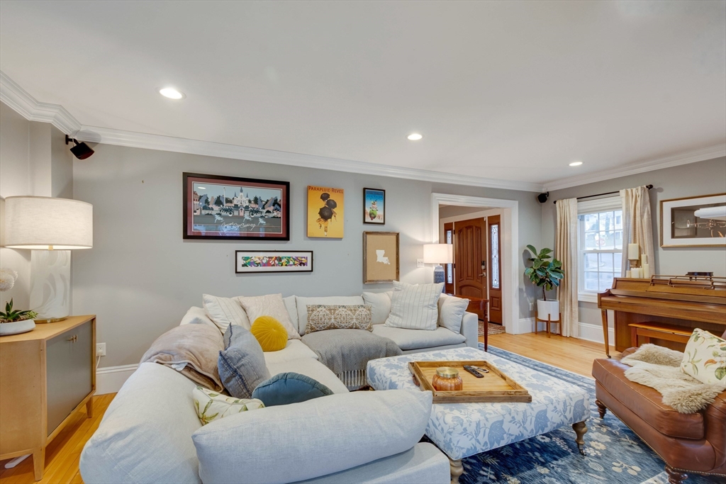 12 Mishawum Road Woburn, MA 01801 - Photo 5 of 39 a living room with furniture a lamp on wooden floor and a lamp