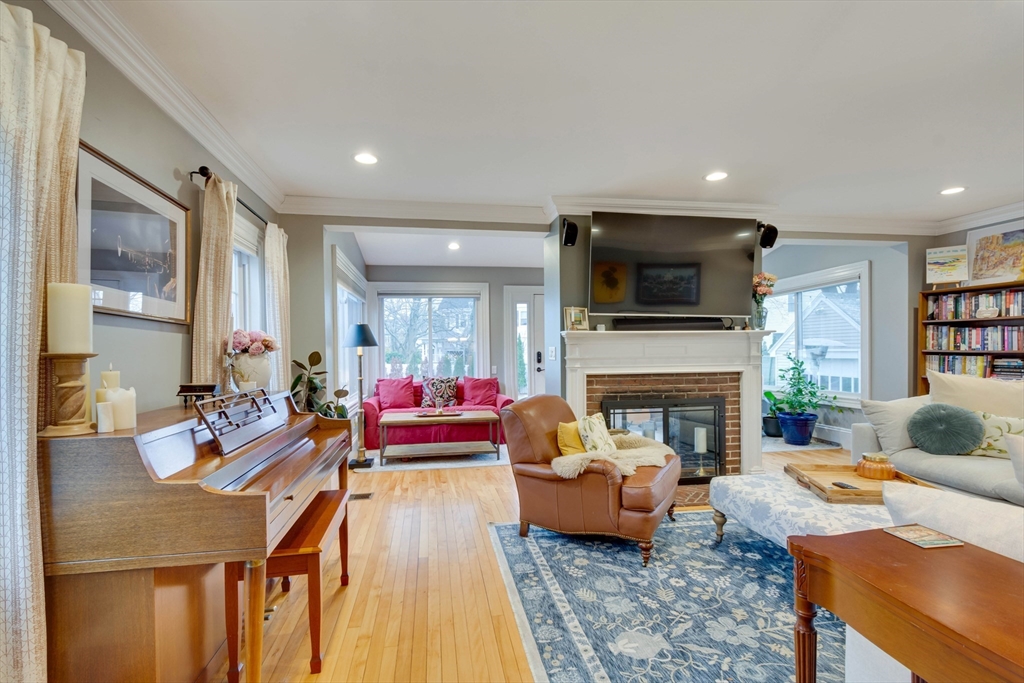 12 Mishawum Road Woburn, MA 01801 - Photo 6 of 39 a living room with furniture fireplace and a flat screen tv