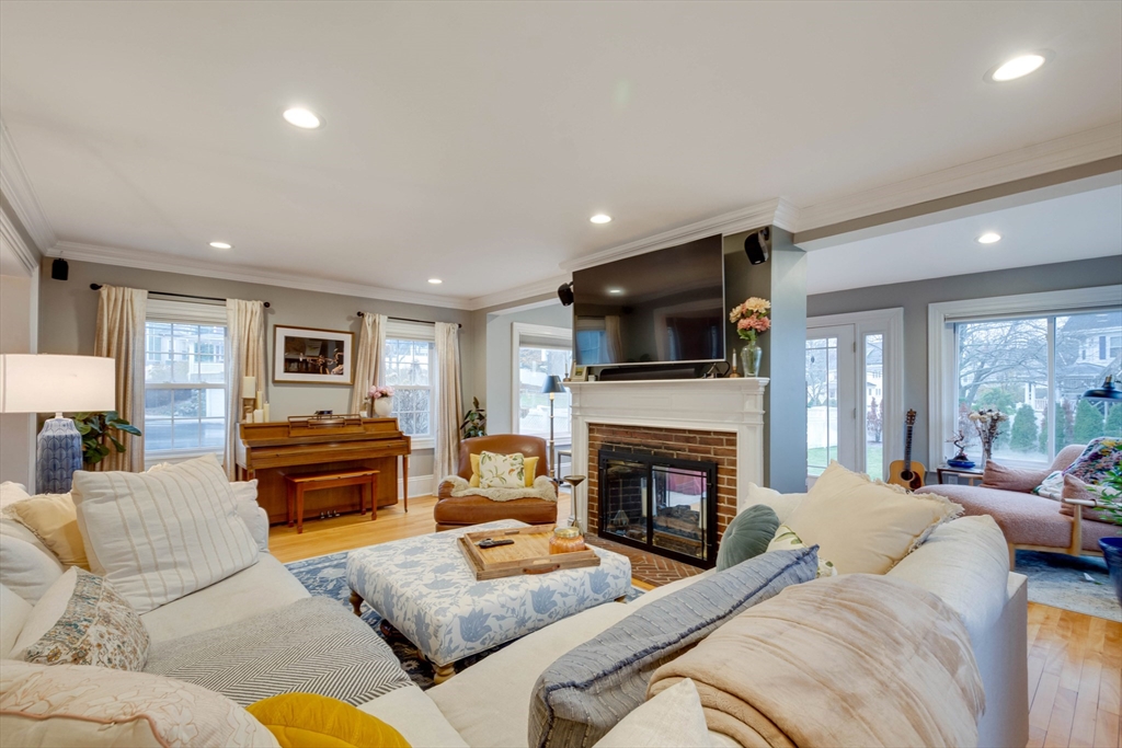 12 Mishawum Road Woburn, MA 01801 - Photo 7 of 39 a living room with furniture fireplace and a flat screen tv