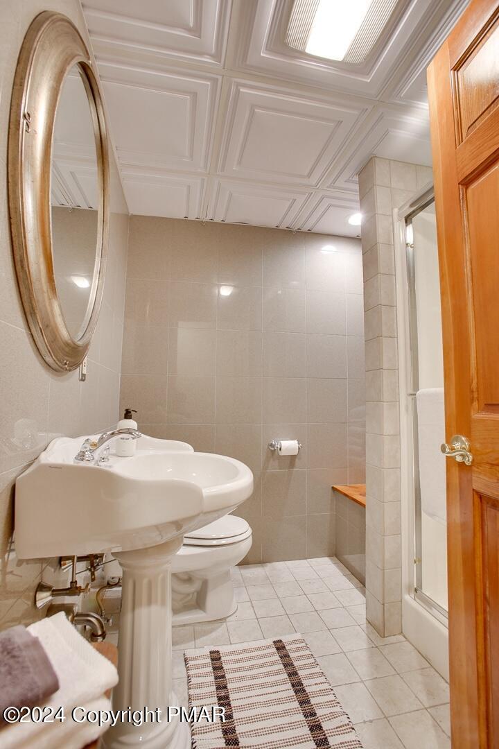 85 Starview Lane Wapwallopen, PA 18660 - Photo 28 of 102 a bathroom with a sink a toilet and a mirror
