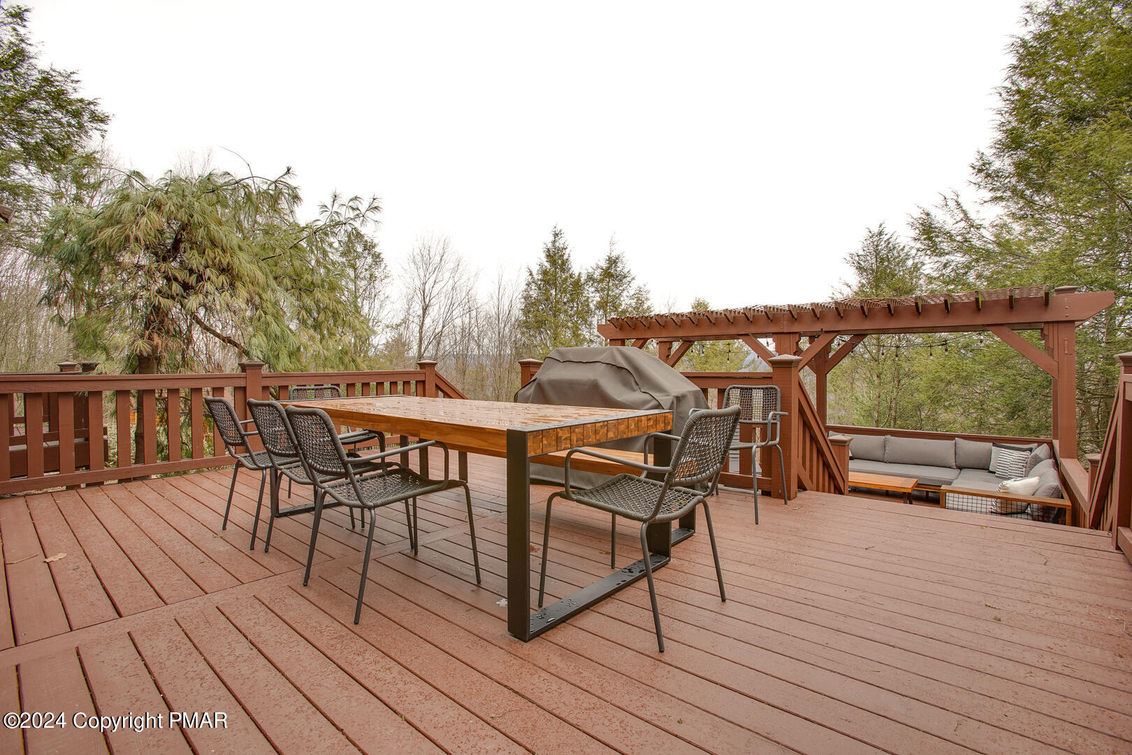 85 Starview Lane Wapwallopen, PA 18660 - Photo 41 of 102 a view of a roof deck with table and chairs a barbeque with wooden floor and fence