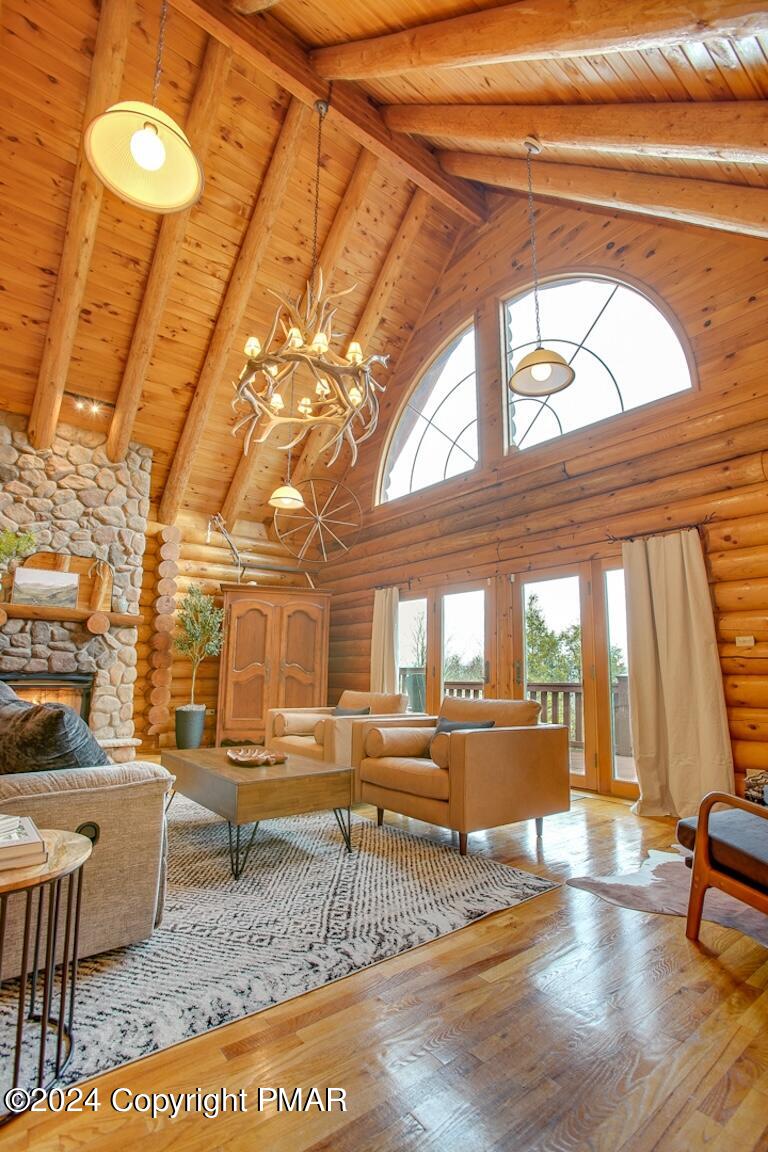 85 Starview Lane Wapwallopen, PA 18660 - Photo 71 of 102 a living room with couch and a dining table with wooden floor