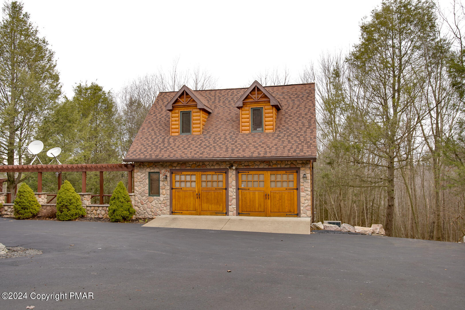 85 Starview Lane Wapwallopen, PA 18660 - Photo 90 of 102 a front view of a house with a yard and garage