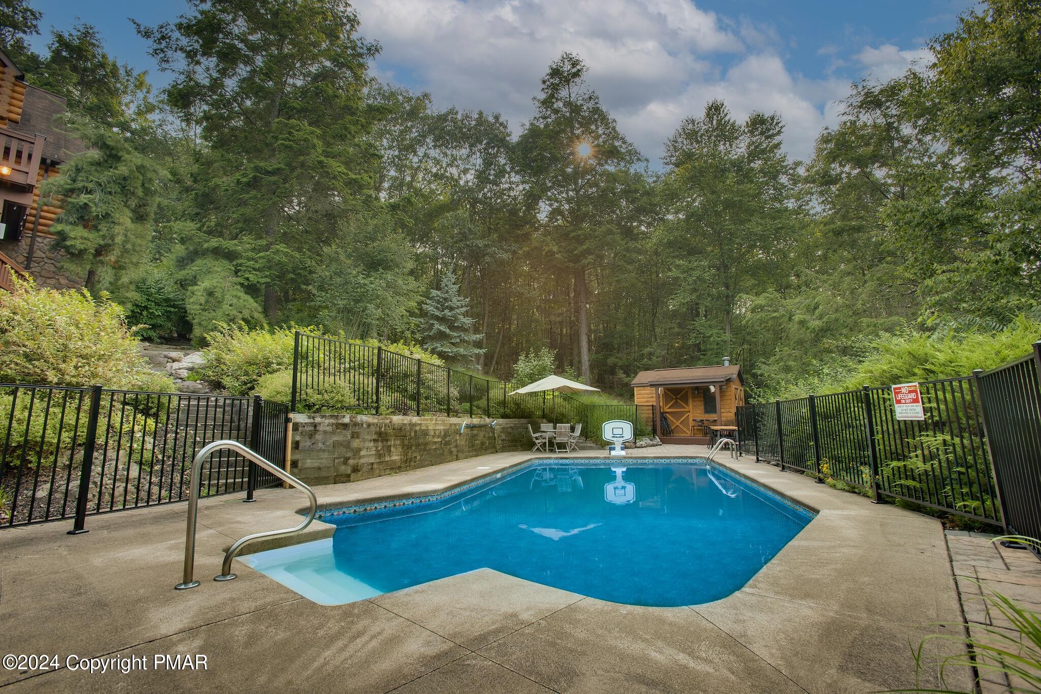 85 Starview Lane Wapwallopen, PA 18660 - Photo 100 of 102 a view of a swimming pool with a patio and plants