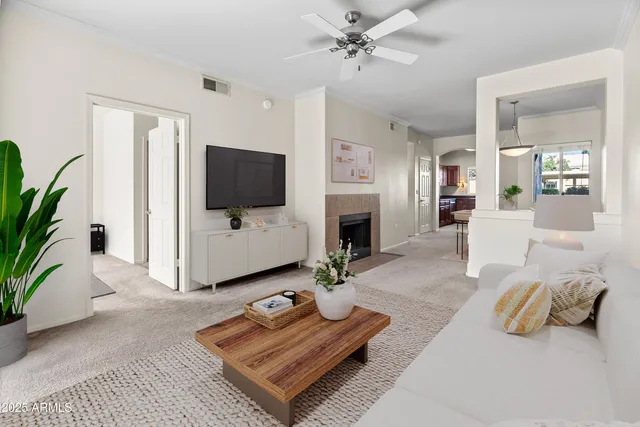 a living room with furniture and a flat screen tv