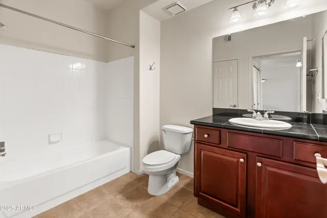 a bathroom with a sink a toilet and a bathtub