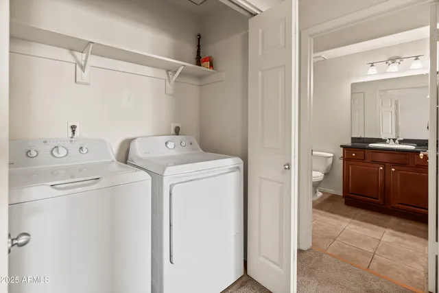 a utility room with dryer and washer