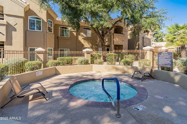 a view of a swimming pool with a lounge chairs