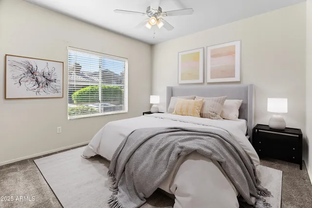 a bedroom with a bed and a window