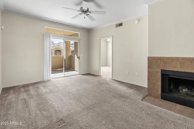 a view of empty room with fireplace