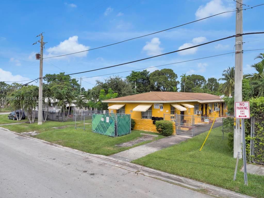 47 Northeast 80th Terrace Miami, FL 33138 - Photo 5 of 26 a view of a white house with a big yard and potted plants