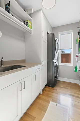 a spacious bathroom with a granite countertop sink and a refrigerator