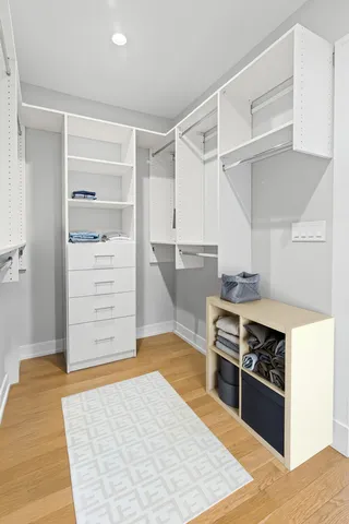 a view of kitchen with cabinets and wooden floor