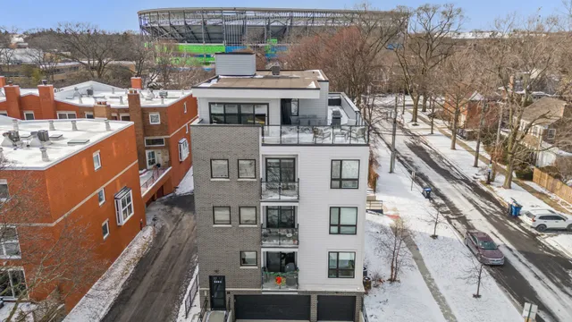 a view of a buildings with a roof deck