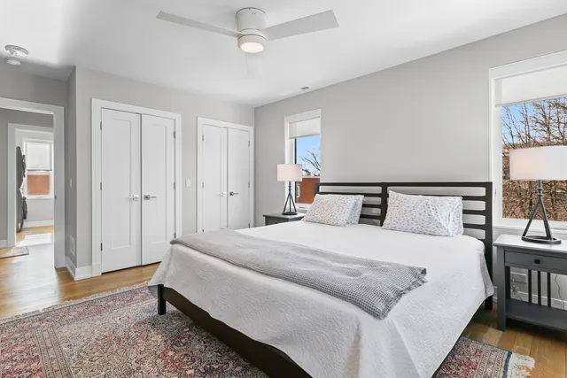 a spacious bedroom with a bed and a window