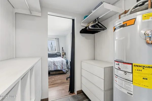 a bedroom with a bed and a ceiling fan