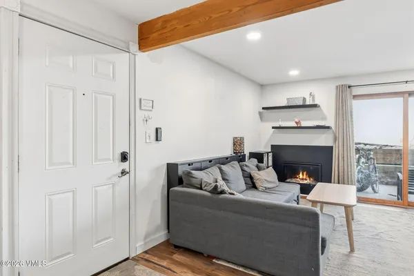 a living room with furniture and a fireplace
