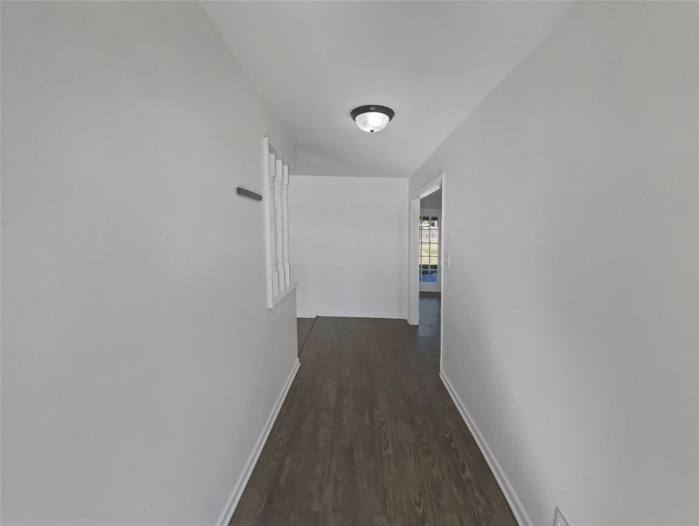 1105 East 17th Street Georgetown, TX 78626 - Photo 7 of 17 a view of a hallway with wooden floor and staircase