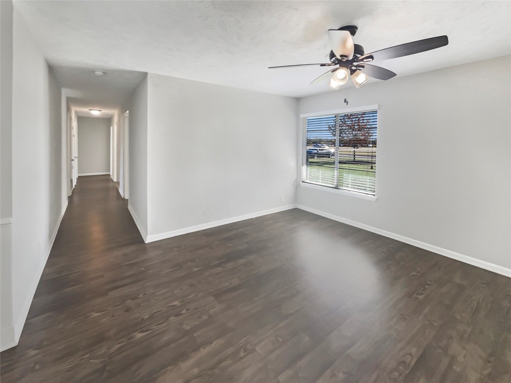 1105 East 17th Street Georgetown, TX 78626 - Photo 8 of 17 wooden floor in an empty room with a window