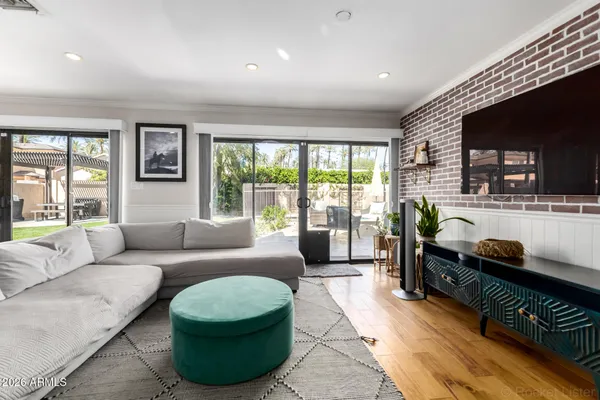 a living room with furniture and a flat screen tv