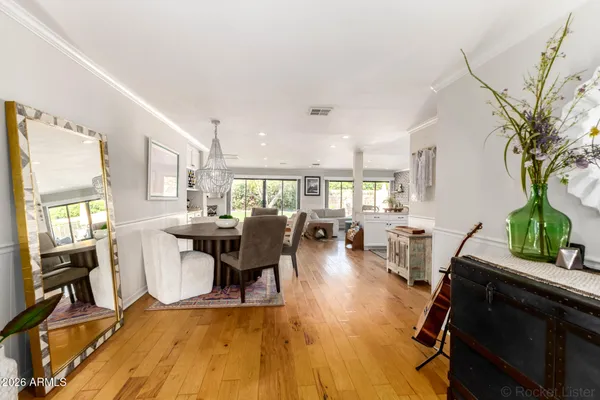 a view of a dining room with furniture window and wooden floor
