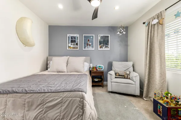 a bed room with a bed and a couch