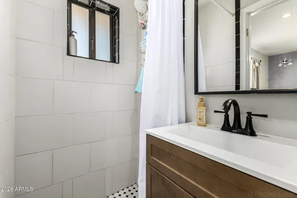 a bathroom with a sink and a mirror